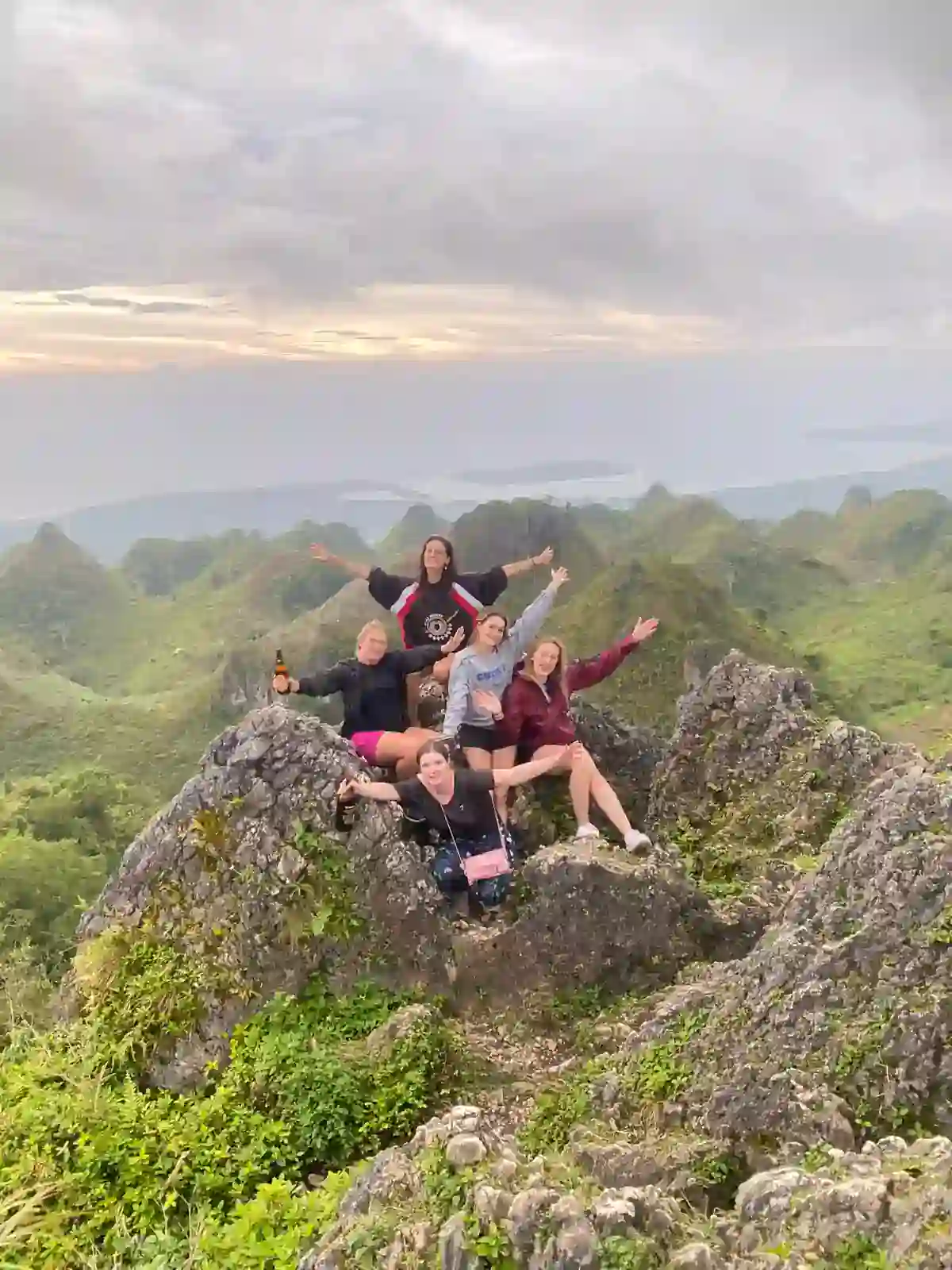 Group on the limestone summit of Osmeña Peak, Cebu, at sunrise in March